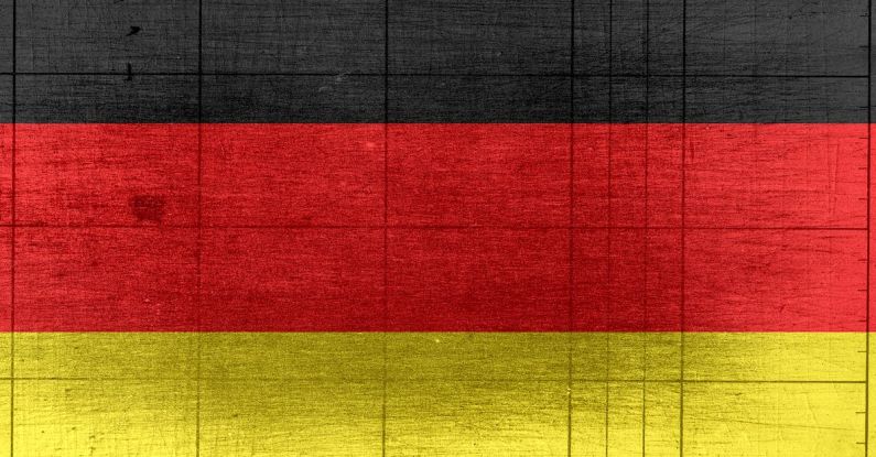 AI Global - Grungy background designed as flag of Germany on shabby wooden board with measure scale