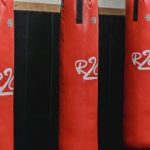 AI Supply Chain - Interior of boxing gym with heavy punching bags hanging on chains for workout