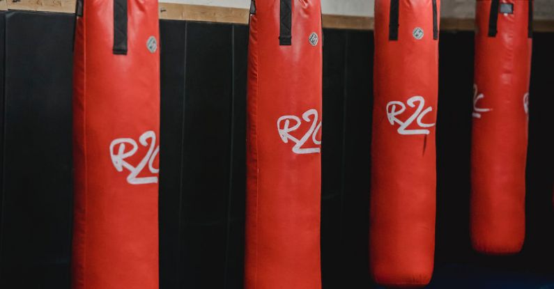 AI Supply Chain - Interior of boxing gym with heavy punching bags hanging on chains for workout