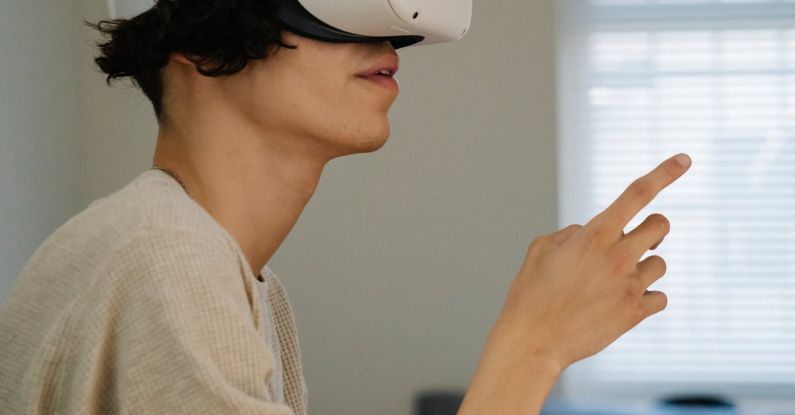 VR Design - Side view of male gesticulating while experiencing virtual reality in headset in house room in daytime