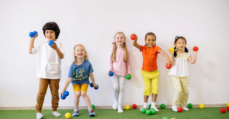 Indie Games - Little Girls and Boys Having Fun Playing With Colorful Balls