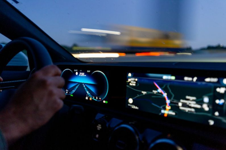 Autonomous Cars - person's hand on steering wheel