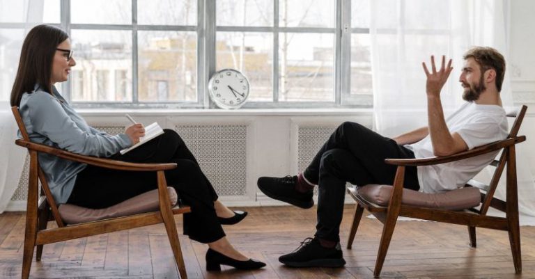 Gaming Mental Health - Person in Black Pants and Black Shoes Sitting on Brown Wooden Chair