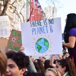 Climate Action - person holding there is no planet b poster