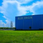 Blue Origin - a large blue building with a sign on it