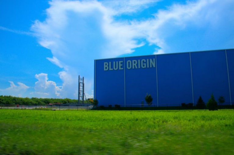 Blue Origin - a large blue building with a sign on it