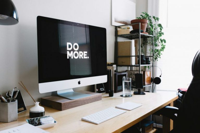 AI Lifestyle - silver iMac with keyboard and trackpad inside room